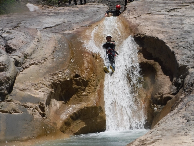  Falling down the rock slide on the canyoning route 